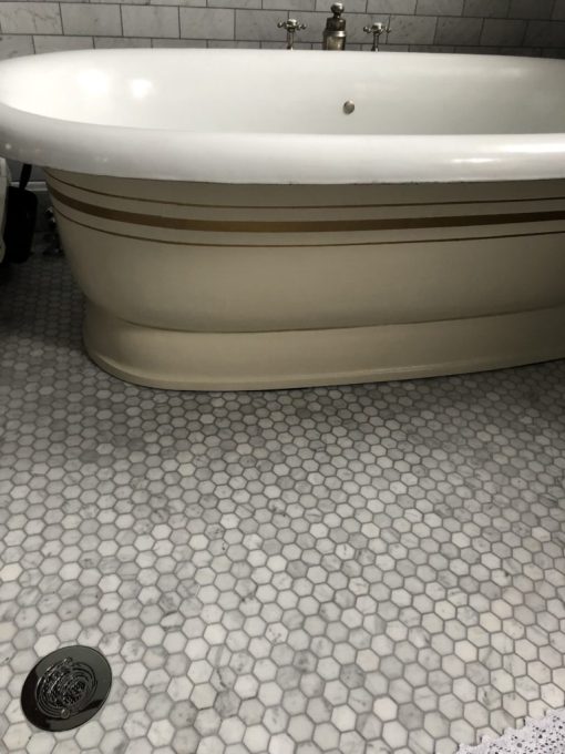 round shower drain with waves design